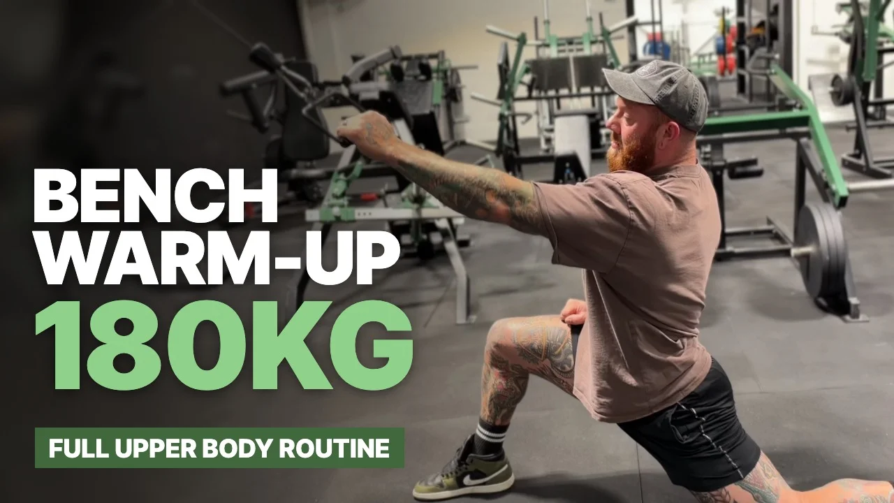 Jordan Helyer in a split-stance cable pulldown with the text Bench Warm-Up 180kg, full upper body routine