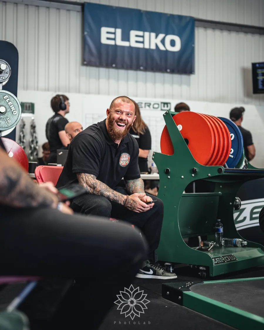Jordan Helyer laughing beside the competition platform