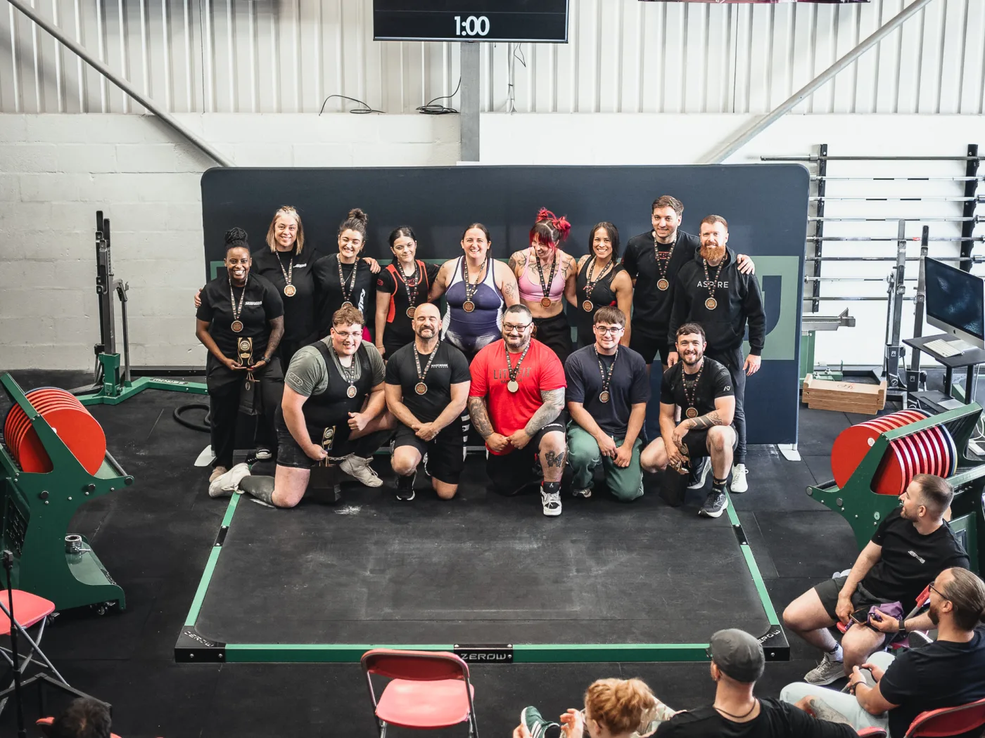 Kilo Classic III lifters with their medals on the competition platform at ZeroW Wales